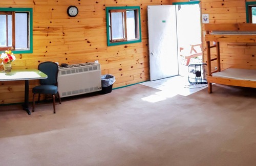 Pepin Cabin | This camper cabin with attached bathroom makes the perfect summer camp retreat!
