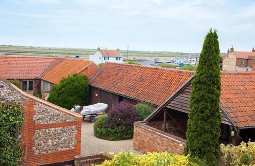 Brancaster Staithe Cottage | This delightful cottage has a fabulous open-plan kitchen/dining area with fitted kitchen. French doo