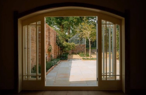 Bunbury House | This historic building offers an inviting retreat with its charming blend of comfort and elegance.