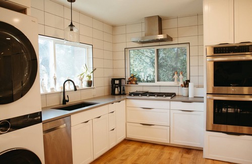 Prairie Lea RV Rental | This home sits on a 45 acre, wooded retreat and event venue called Wild Roots Lockhart with tons of amenities including pickleball!