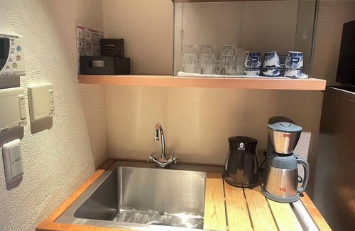Karasuma House | This is a single building rental of a Kyomachiya that has been in existence since the Meiji Era (1868-1912). The window overlooks the Kamo River and the town of Gion, making it a prime location to enjoy the typical Kyoto scenery.