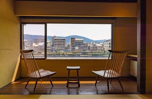 Karasuma House | This is a single building rental of a Kyomachiya that has been in existence since the Meiji Era (1868-1912). The window overlooks the Kamo River and the town of Gion, making it a prime location to enjoy the typical Kyoto scenery.