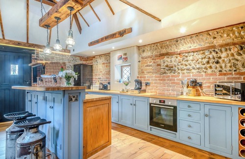 Ingham Cottage | This picture-perfect barn conversion, boasts a private hot tub and sauna.