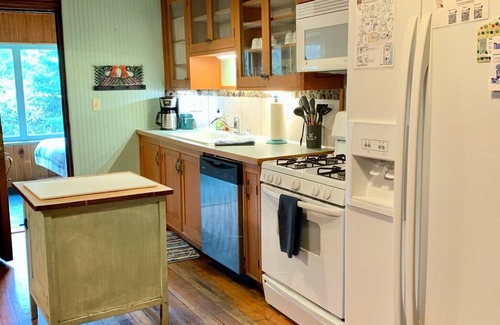 Ashford Cabin | This rare historic lodge at Mt. Rainier National Park has 4 bedrooms, Copper Creek frontage, a private hot tub on the creek, and is off the highway. Children welcome. Short walk to Copper Creek Restaurant.