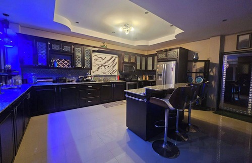 Claxton Bay House | This spacious property features a fully equipped kitchen, and an inviting small pool