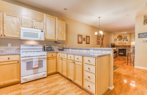 Government Camp Condo | Three-story retreat with a gas fireplace plus access to pool, hot tub, & sauna