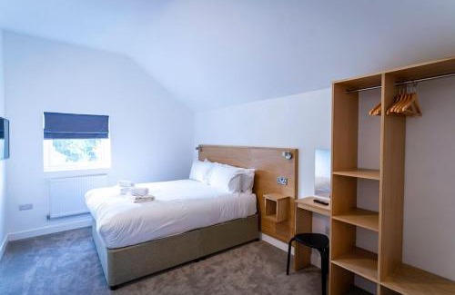Farley House | Throwley, woodland lodge with hot tubs for 14