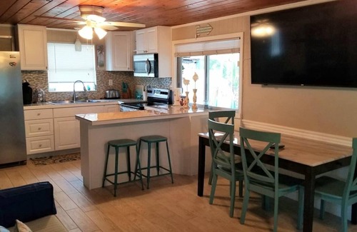 Weeki Wachee Gardens House | Tiki Tropical Retreat - directly on the clear Weeki Wachee River (not a canal)