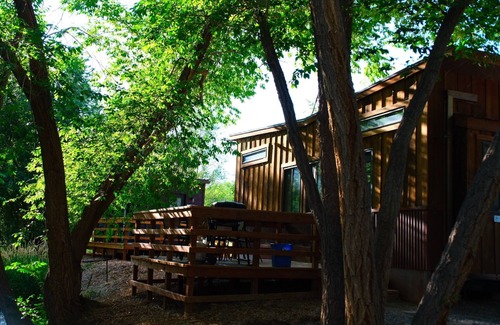 Montrose House | Tiny home located beside a creek.