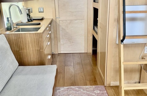 Montrose House | Tiny home with one lofted queen bed and full size futon.