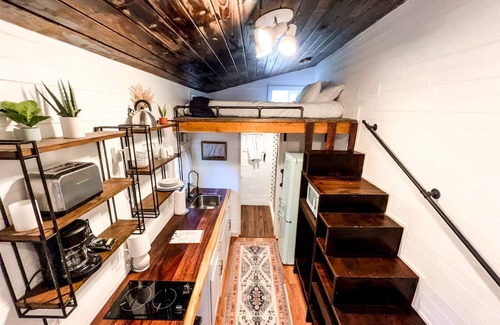 Montrose House | Tiny home with one lofted queen bed and twin sized day bed.