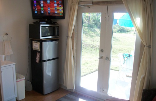 Dunmore Town House | Tiny House Vacation, Bayfront with private beach area! On two secluded acres!
