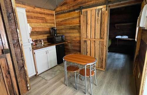Burkesville House | Tiny house with deck and swing