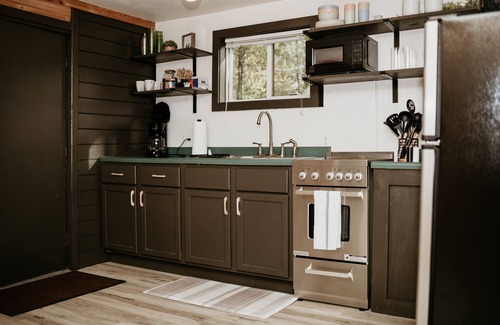 Cushing Cabin | Tiny Timber, tiny cabin with a Scandinavian flair! Sauna & plunge tub!