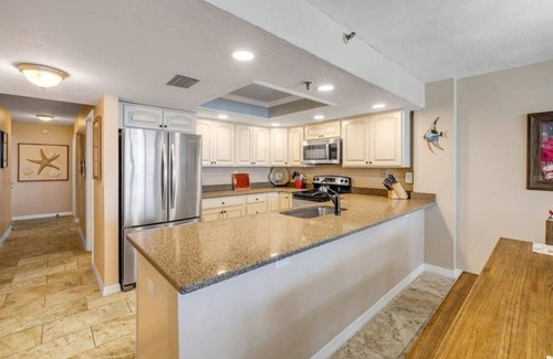 New Smyrna Beach Condo | Top floor beach front suite with 27' balcony & rooftop pool.