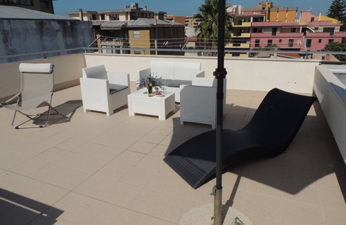 Oristano Apartment | Top floor penthouse apartment with terrace in the historical center, 3 km from the beach