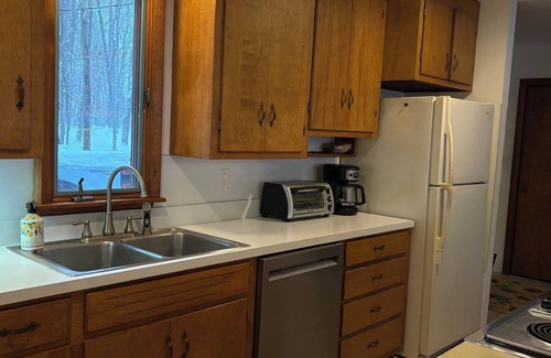 Alden Cottage | Torch lake waterfront:100 ft of sandy beach, 3-bedroom, 3-bath cottage