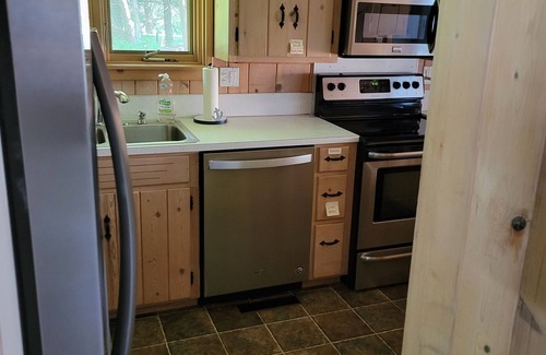 Bellaire Cottage | TorchLakeFlightDeck.com cottage with 180’ on Lakefront Waterfront Beachfront!