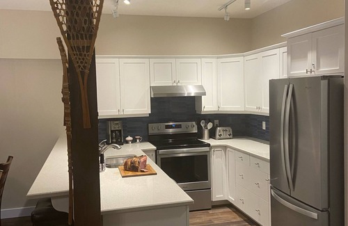 Okanagan-Similkameen Hotel | Townhouse backing onto the skating loop