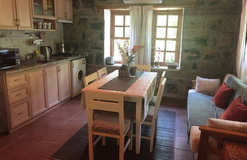 Kayakoy Cottage | Traditional stone cottage with stunning garden in historic Kaya village.