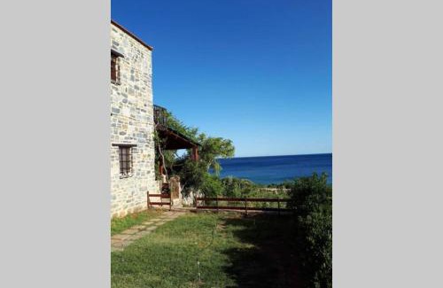 Gortyna House | Traditional stone house by the sea.