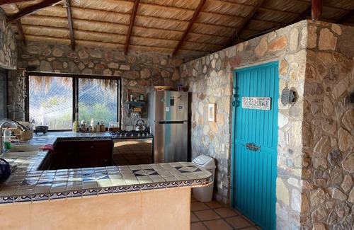 Cabo Pulmo House | Traditional stone palapa retreat with ocean and desert views