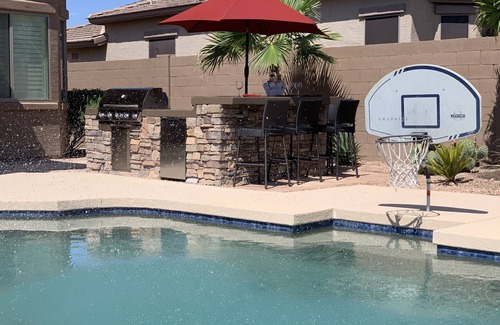 Estrella Mountain Ranch House | Tranquil Backyard with Pool/Spa, BBQ, and Putting Green.