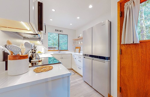Warnick House | Tranquil forested oasis near rivers and trails with firepit, games, & wood stove