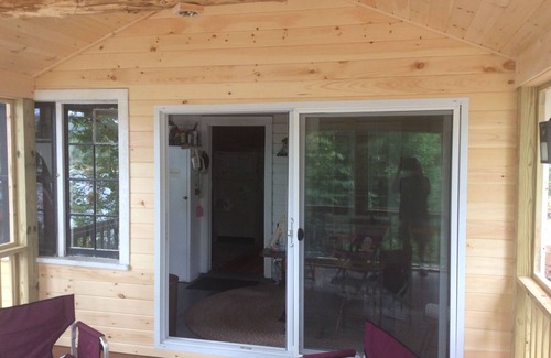 Wells House | Tranquil lakefront home sits above the lake with an unobstructed view
