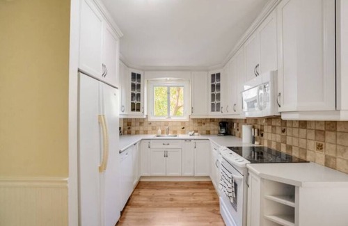 Saint-Raymond Cabin | Tranquil Riverfront Chalet with Hot Tub & Kayaks