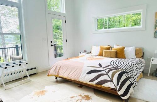 Dryden House | Tranquil Waters - Modern Lakefront Haven with Hot Tub - Explore, Relax, and Recharge! Close to UMF!