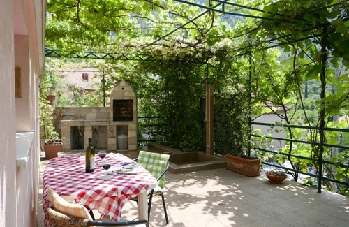 Risan Apartment | Tranquillity & comfort - spacious studio & terrace, relax under the vine canopy.