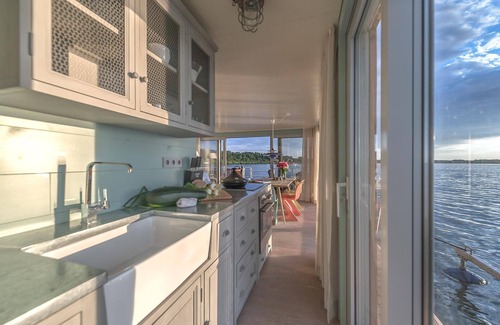 Uecker-Randow Boat Rental | traumHaff houseboat La Péniche/Baltic Sea - design, sunset & sauna on board