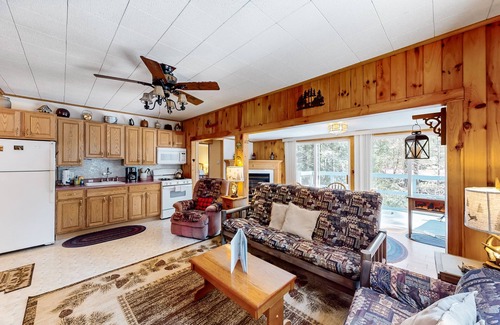 Warrensburg Cottage | Tree-lined dog-friendly cottage with wrap-around deck, grill, & gas fireplace
