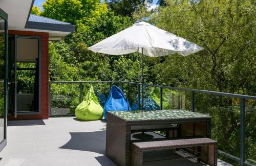 Waipahihi House | Treetop Living, Peaceful 4BR With Scenic Bush Views