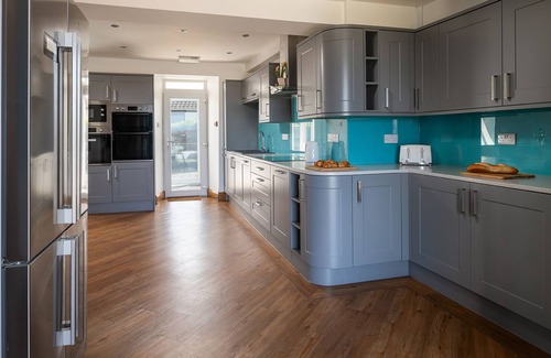 Holyhead House | Trefonen House- Beachfront with hot tub & BBQ hut