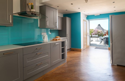 Holyhead House | Trefonen House- Beachfront with hot tub & BBQ hut