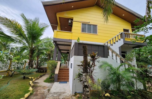 Morong Villa | Triple M Vacation Villas - Yellow house