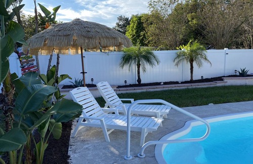 Largo House | Tropical Backyard Heated Pool House Close to Beach