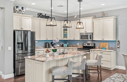 Cocoa Beach House | Tropical Backyard Oasis w/Screened in Outdoor Patio, Pool, Gas Firepit & BBQ Grill!