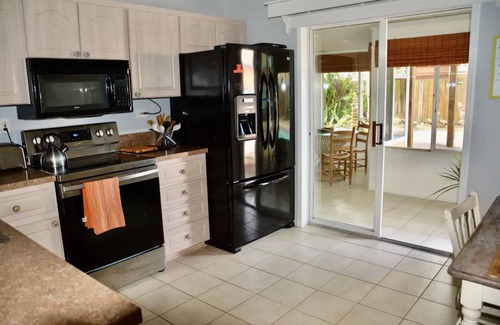 Fowlers House | Tropical Island House, Heated Pool, Near Beach, Disney, Kennedy Space Center