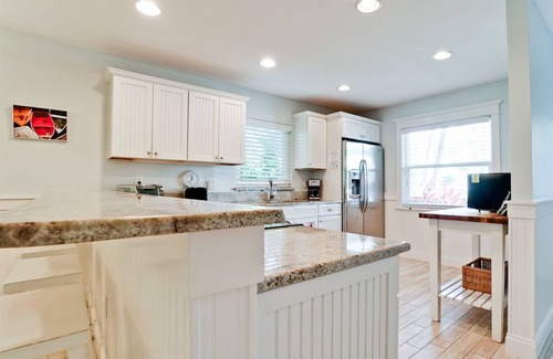 Anna Maria Cottage | Tropical Landscaped Beach Cottage with Heated Jetted Pool