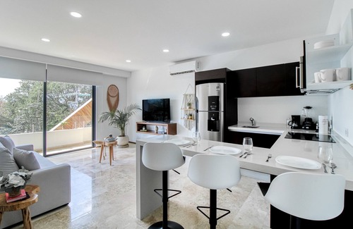 Tulum City Center Apartment | Tropical luxurious apartment with pools, rooftop views, & balcony - dog-friendly
