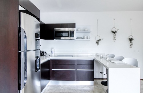 Tulum City Center Apartment | Tropical luxurious apartment with pools, rooftop views, & balcony - dog-friendly