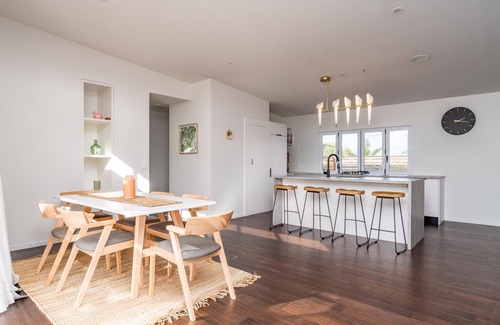 Mangawhai Heads House | Tropical Oasis - Modern, sunny, fully fenced holiday home with beautiful tropical gardens