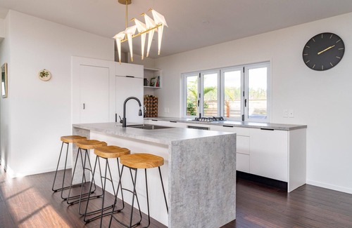Mangawhai Heads House | Tropical Oasis - Modern, sunny, fully fenced holiday home with beautiful tropical gardens