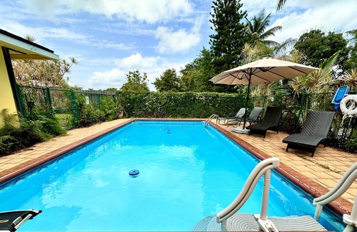 Wellington House | Tropical Oasis Pool home, close to WEF, Airport, and Beaches