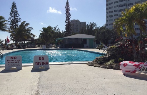 Discovery Bay Condo | Tropical paradise steps away from gorgeous sandy beach & beautiful blue water