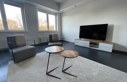 Langenhorn Apartment | TruRetreats Design Loft für 8 Personen I Riesige Küche I eCharger I 65z SmartTV I 150qm