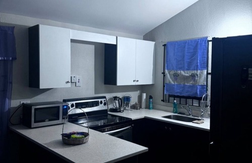 Spring Village House | Ts Staycation - a charming 2-bedroom house with WiFi, AC in Spanish Town